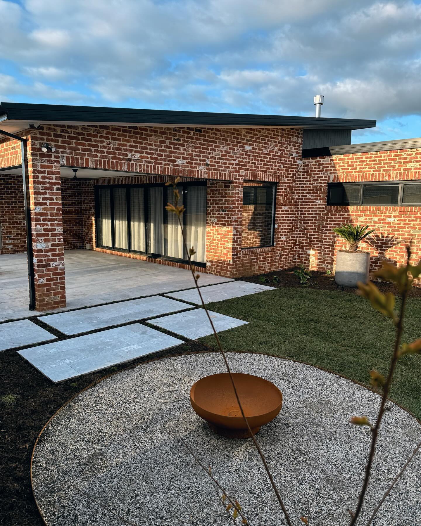 Fire bowl courtyard by Bentley Landscapes
