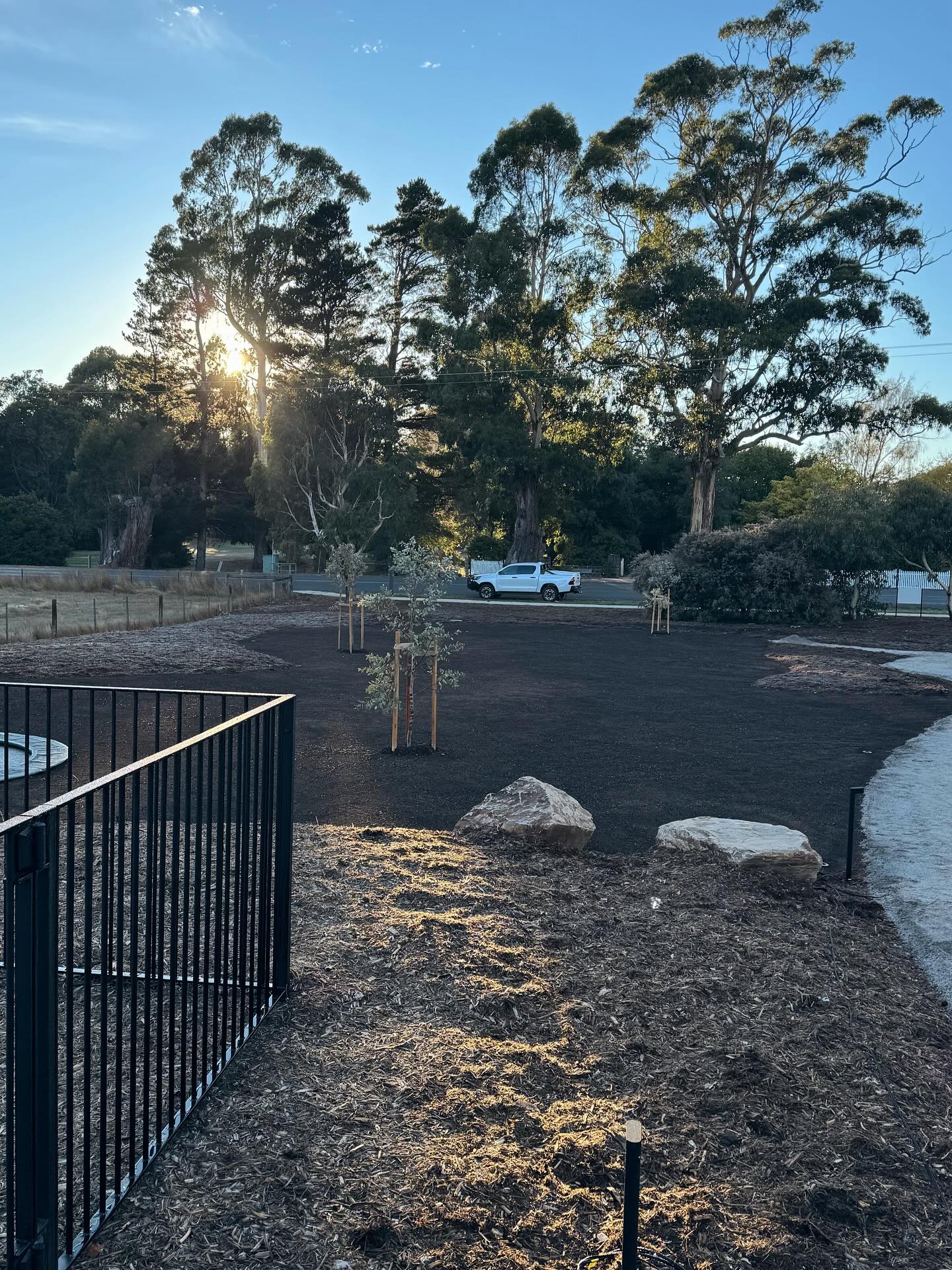 Rural fire pit and landscape setting by Bentley Landscapes