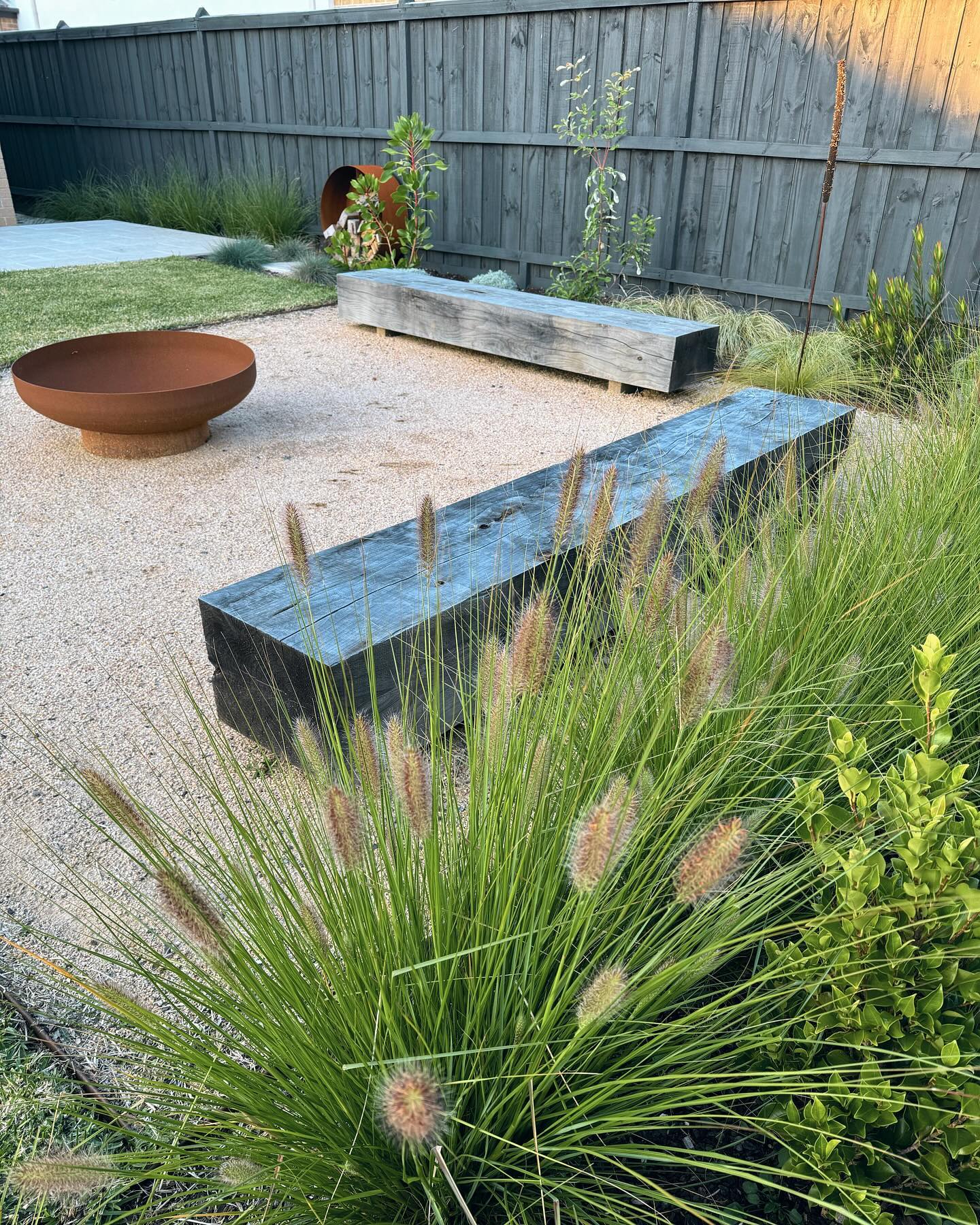 Fire bowl courtyard seating by Bentley Landscapes